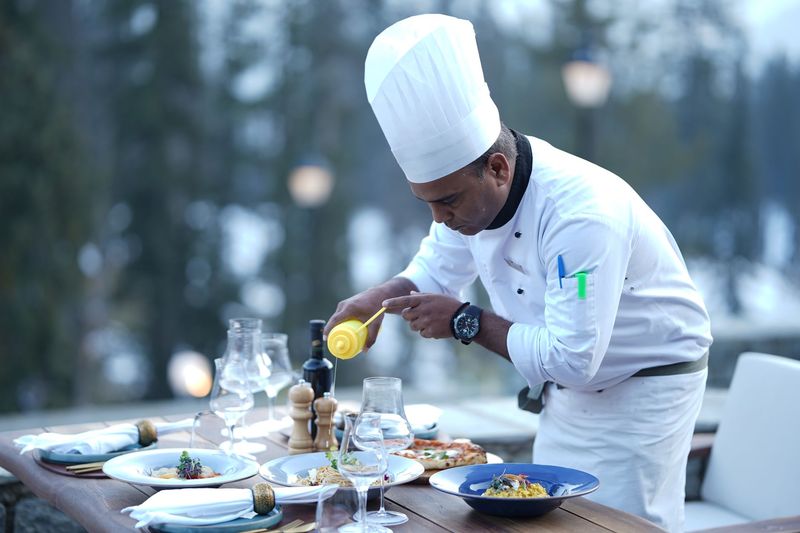 Fresh herbs and prepared ingredients in a professional kitchen